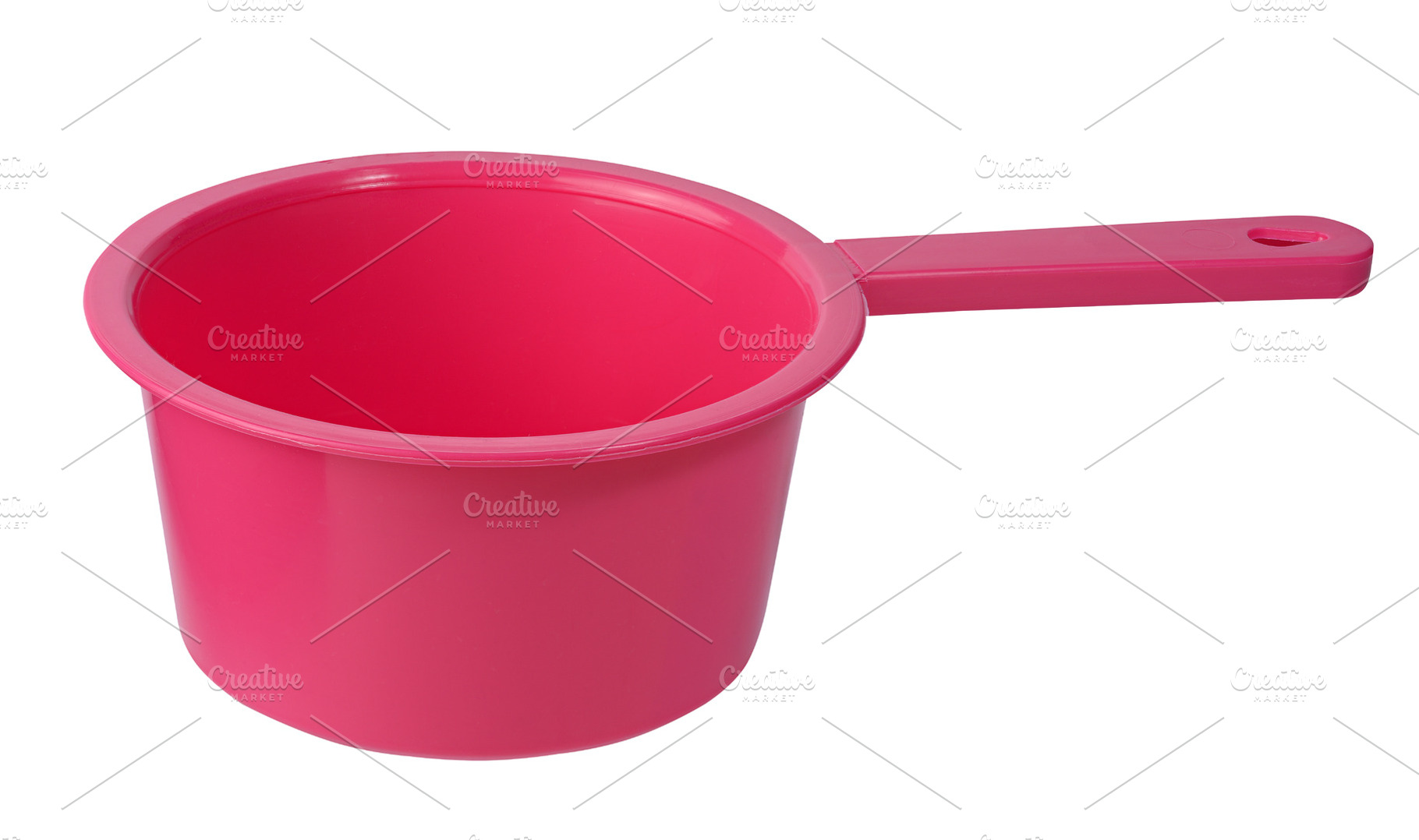 Plastic kitchen ladle of bright pink color with long handle, iso, an Abstract Photo by ndanko