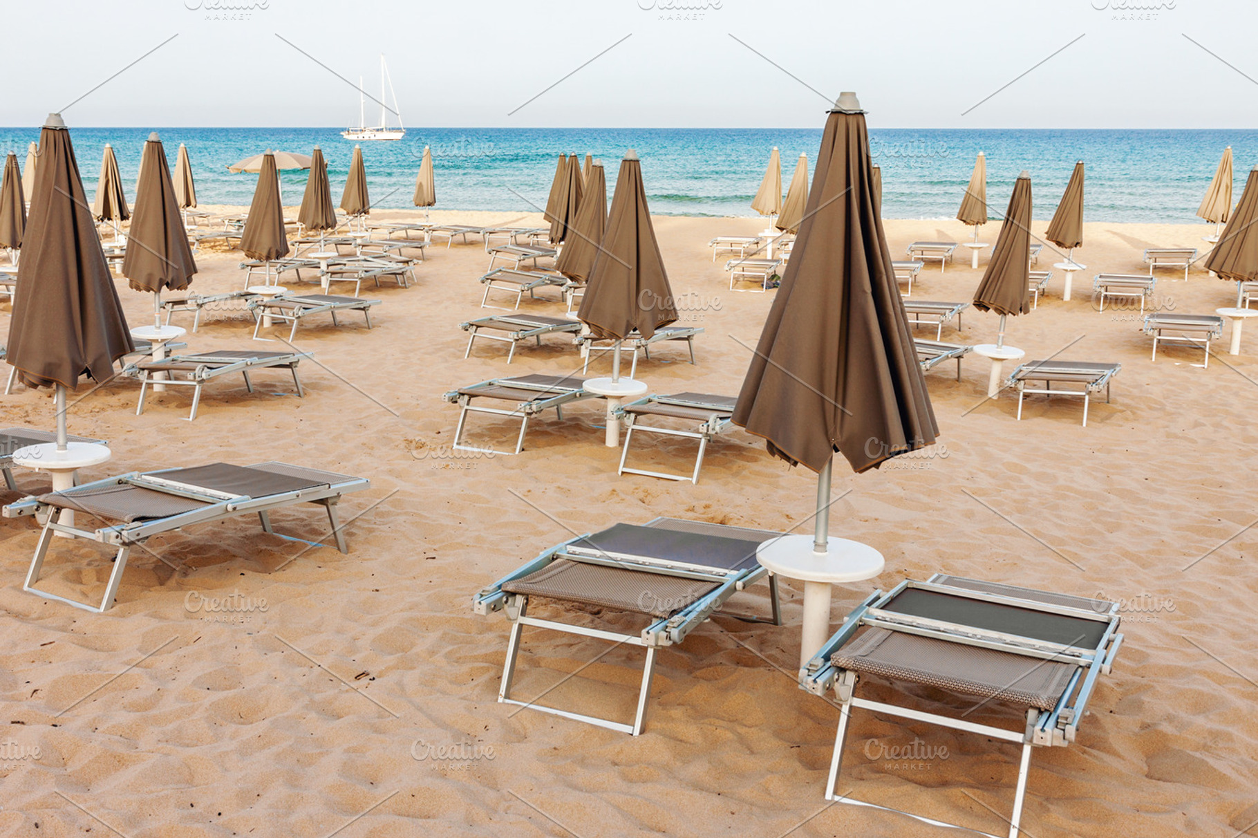 Empty beach with closed paraso, a Holiday Photo by BOOCYS