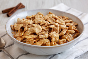 Crunchy Cinnamon Sugar Breakfast Cereal with Milk in a Bowl, sid, a Food & Drink Photo by LiudmylaChuhunova