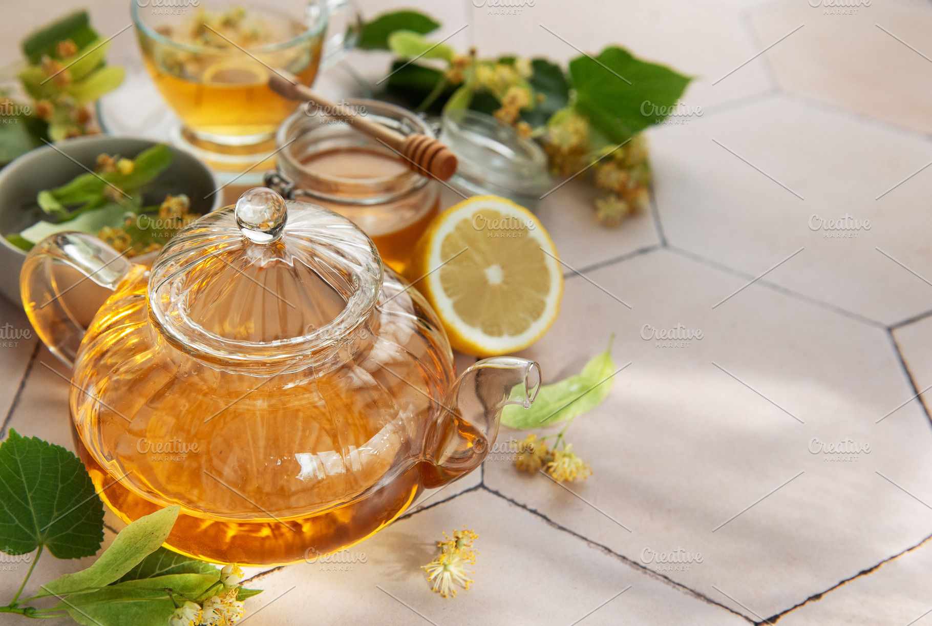 Linden herbal tea brewing with honey and lemon, a Food & Drink Photo by Olena Rudo