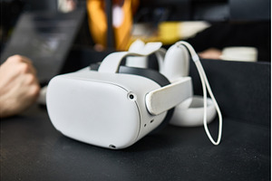 Virtual reality headset on a desk, a Technology Photo by wip3out