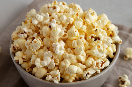 Homemade Salty Popcorn in a Bowl, side view., a Food & Drink Photo by LiudmylaChuhunova