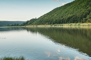 Beautiful river landscape with clouds reflection and castle tower on hill. Scen, a Nature Photo by Rohan Photography
