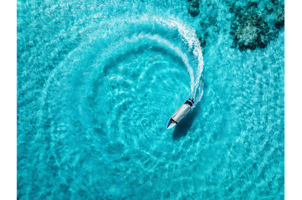 Aerial drone view of the speed boat, a Nature Photo by den-belitsky