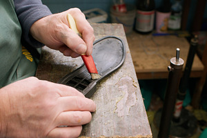 Shoemaker working cobbler workshop glue sole brush, a Person Photo by Photo Drive Studio