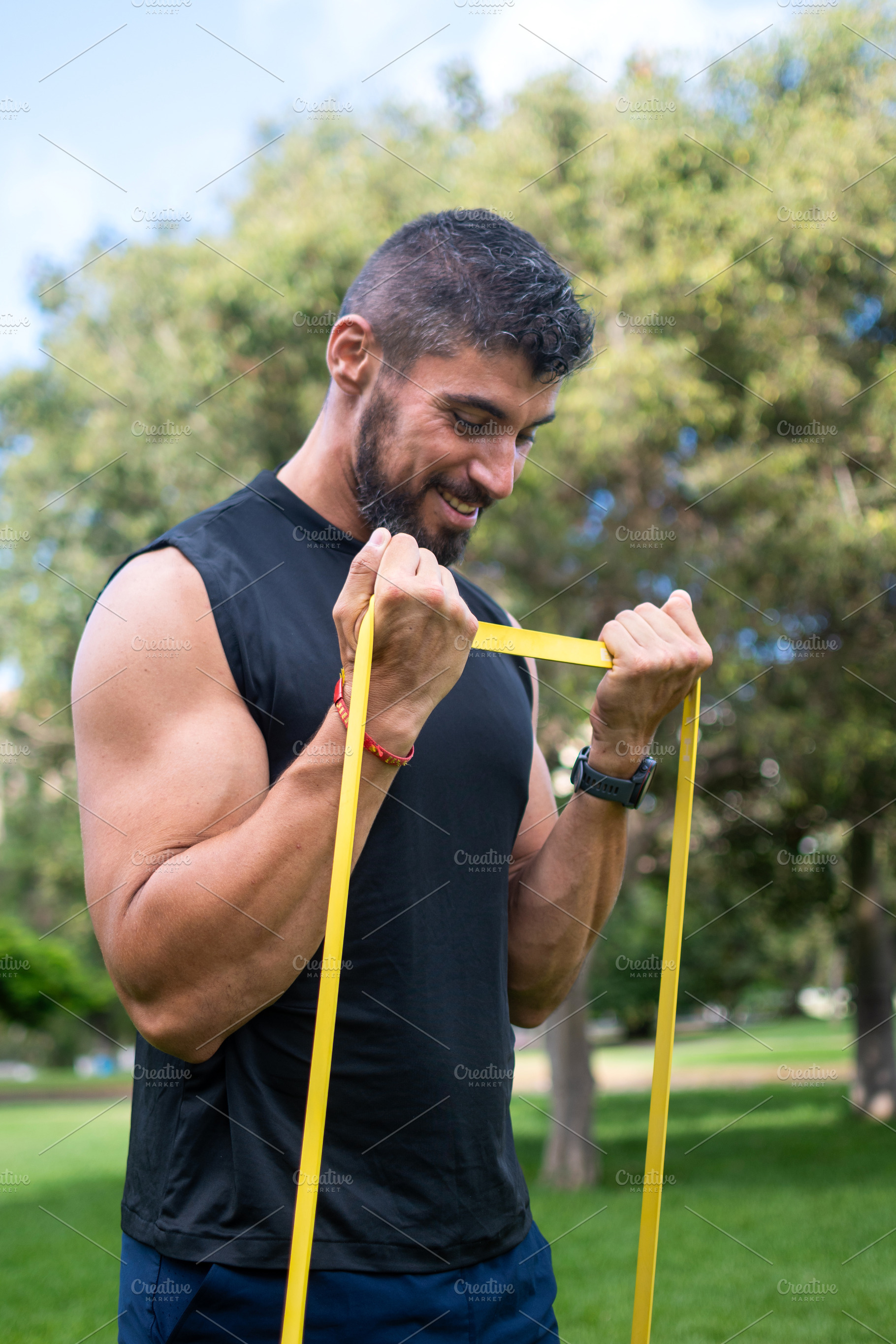 Man doing bicep curl with resistance band, a Sports & Recreation Photo by etorres69