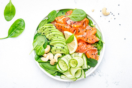 Salmon salad for ketogenic diet with avocado, spinach, cucumber,, a Food & Drink Photo by 5PH