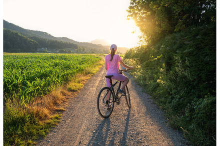Woman on mountain bike on gravel, a Sports & Recreation Photo by den-belitsky