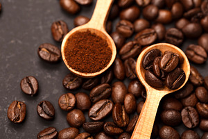 Spoons of freshly ground coffee and
