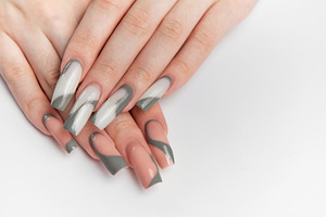 Woman's hands showing long nails with modern design, a Beauty & Fashion Photo by Olena Rudo