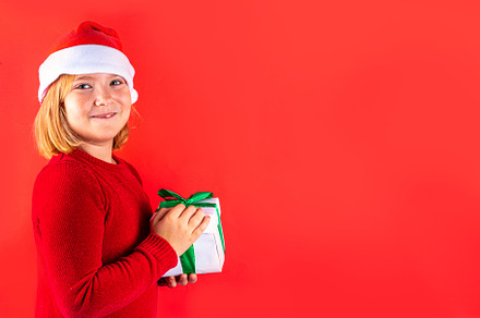 Christmas holiday background with funny girl, a Holiday Photo by Rimma