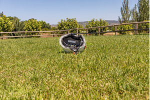 A white helmet on the green grass