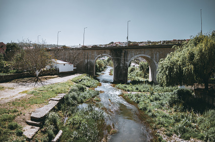Stone bridge over countryside river, an Architecture Photo by SkyNext