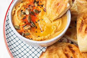 Chickpeas hummus with olive oil featuring appetizer, bean, and bowl
