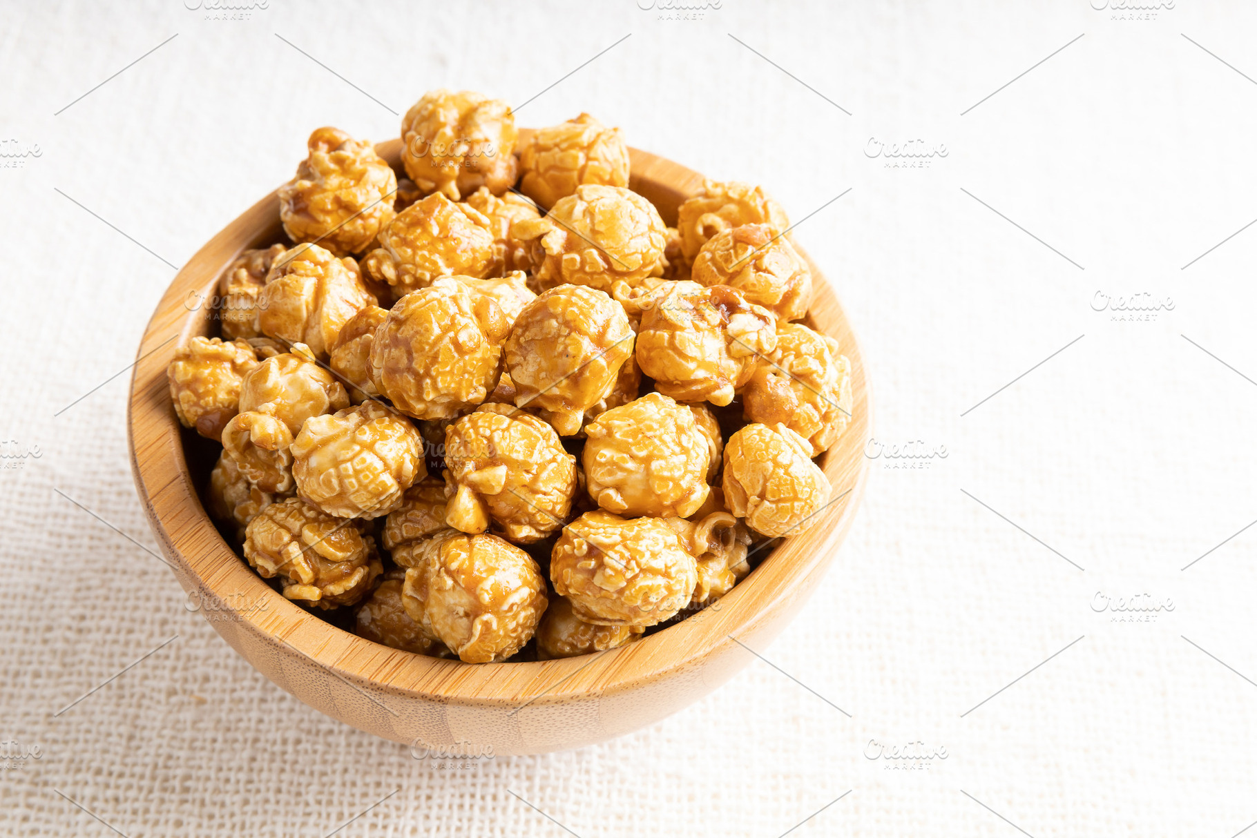Caramel popcorn in bamboo wooden bowl, a Food & Drink Photo by Smith Chetanachan