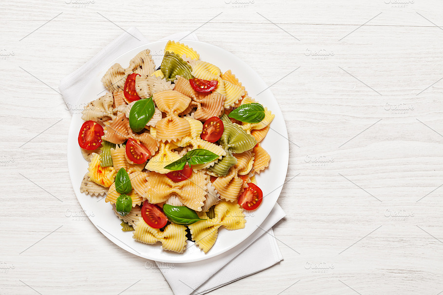Multicolored Pasta On Light Background Containing Background Basil And