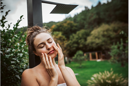 Beautiful woman touching her face, a Beauty & Fashion Photo by HalfPoint