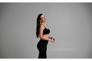 Young woman in black sportswear, a Sports & Recreation Photo by volodymyrshtun13795