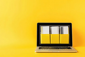 Laptop screen displays yellow file, a Photo by Pavel_design