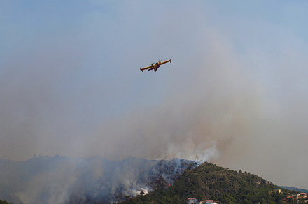 Airplane containing airplane, fire, and firefighter