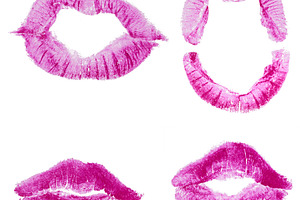 Imprints of human lips painted with pink lipstick on a white bac, a Beauty & Fashion Photo by ndanko
