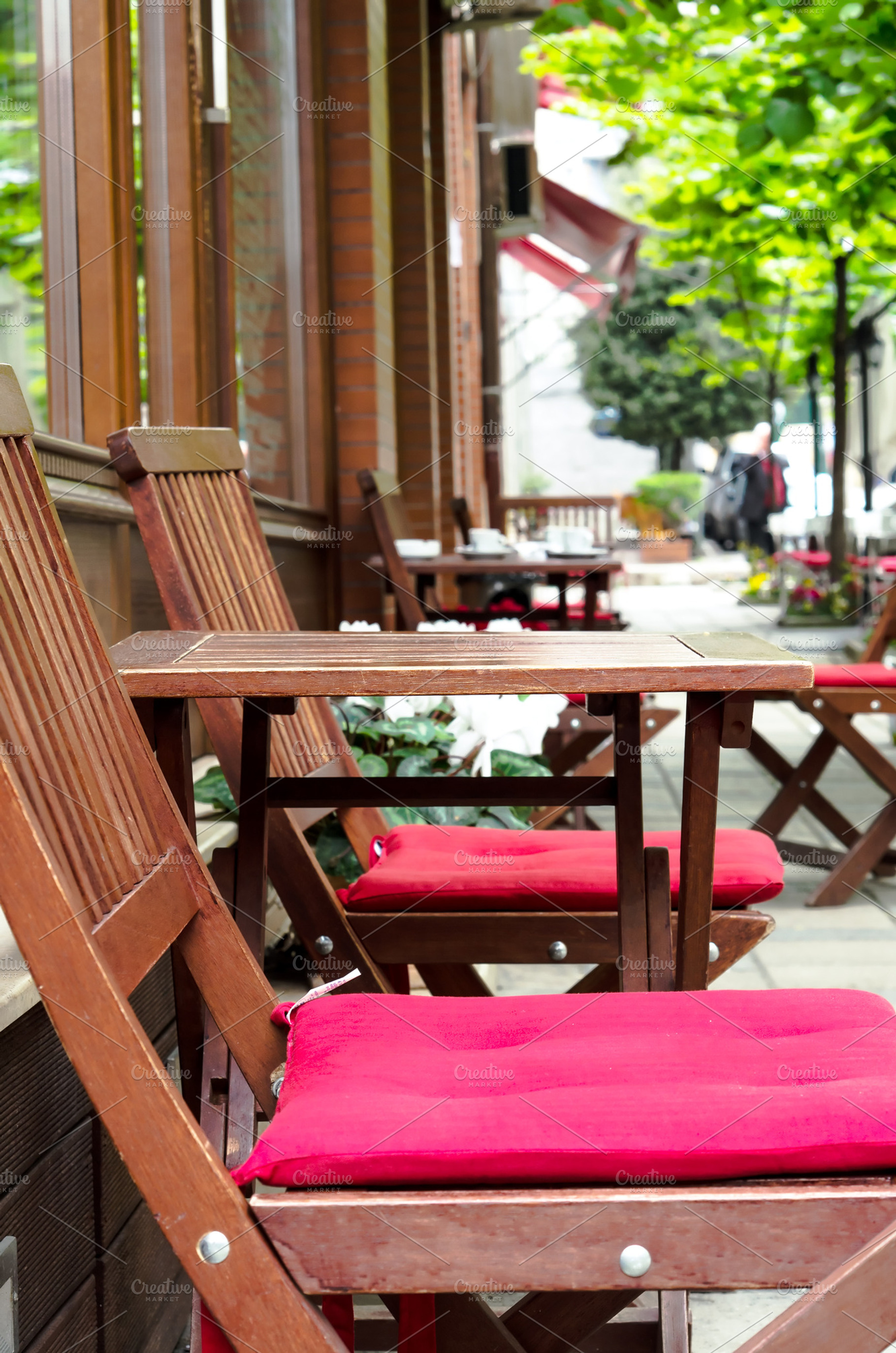 Street cafe with wooden tables