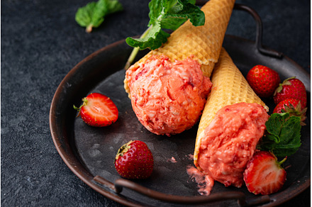 Strawberry ice cream in waffle cone, a Food & Drink Photo by Yulia Furman