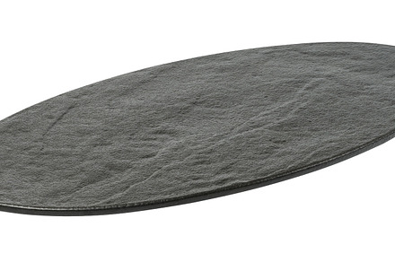Empty black oval board for serving food on a white isolated back, a Food & Drink Photo by ndanko