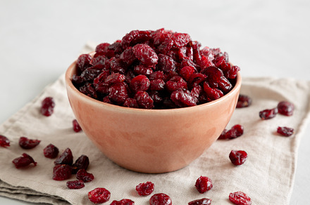 Organic Dried Cranberries in a Bowl, side view., a Food & Drink Photo by LiudmylaChuhunova