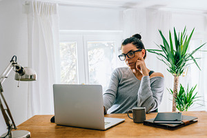 Middle aged woman working remote, a Person Photo by hitdelight