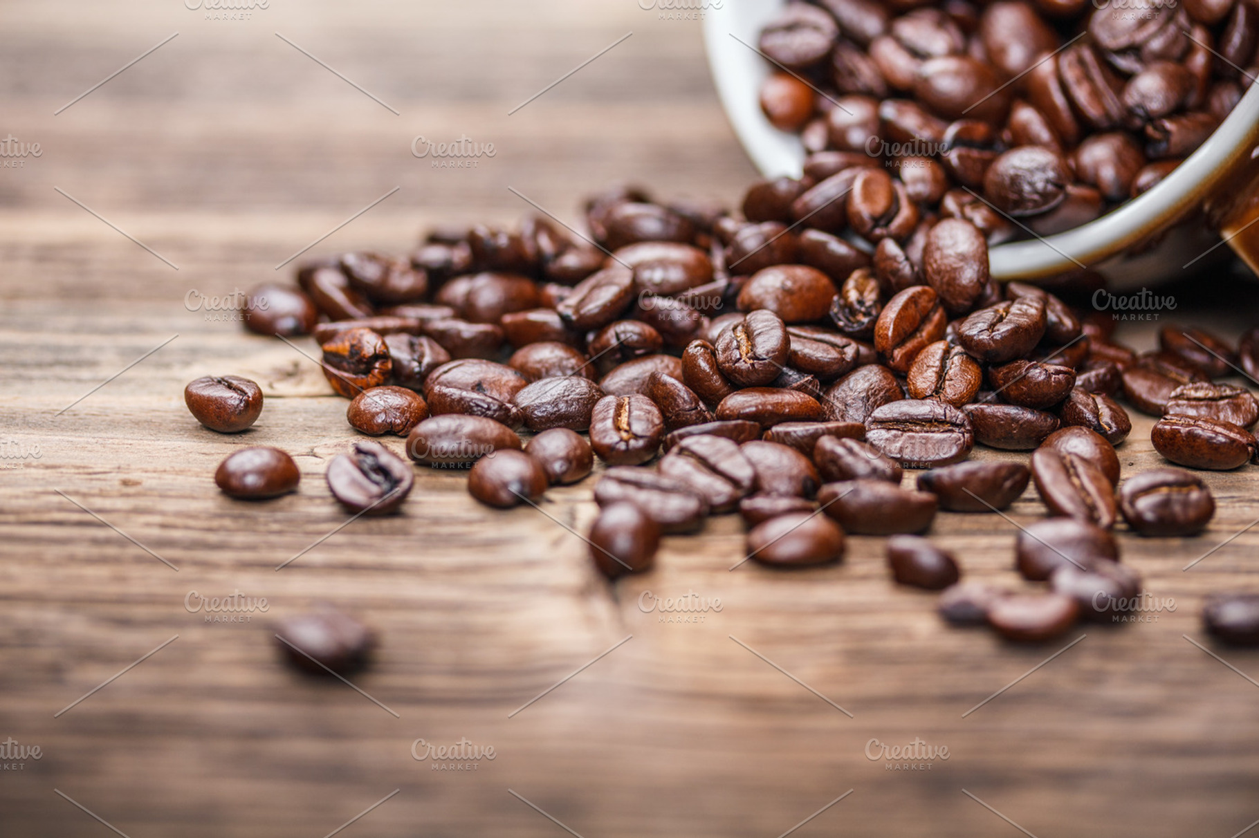 Coffee beans featuring bean, cup, and spill