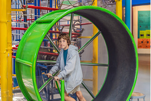 Teenage boy running inside a giant, a Sports & Recreation Photo by Elizaveta Galitskaya