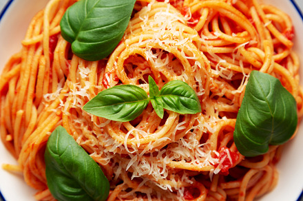 Homemade Pasta Pomodoro on a Plate, top view. Flat lay, overhead, a Food & Drink Photo by LiudmylaChuhunova
