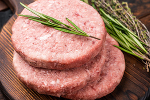 Uncooked beef and pork meat patty on a wooden board, inviting yo, a Food & Drink Photo by composter-box@mail.ru