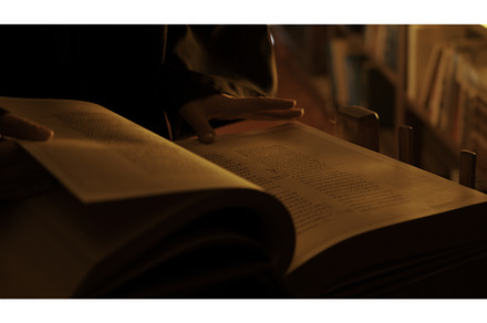 Man reading large mysterious book, a School & Education Photo by Media Whale Stock