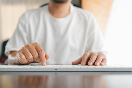 Man working at home, hands pressing computer keyboard, working a, a Business Photo by Art Rachen