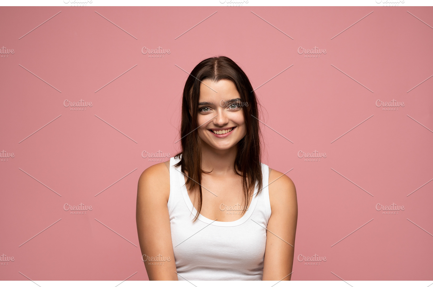 Young brunette woman in white tank, a Person Photo by volodymyrshtun13795