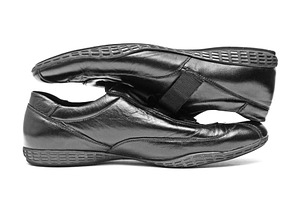 Black shoes isolated, a Photo by saiko3p