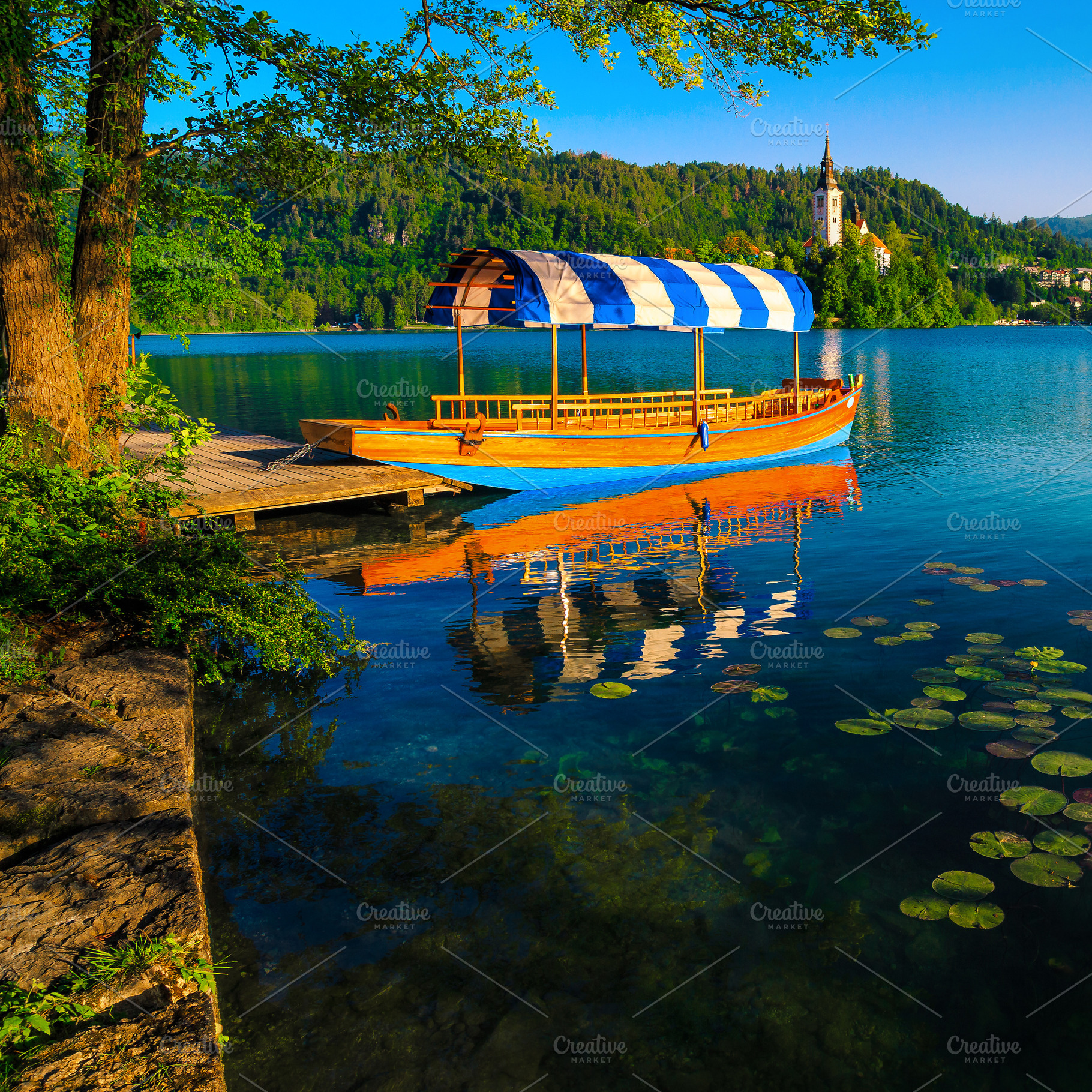 Anchored boat at the wooden pier, a Transportation Photo by Alpine Dreams