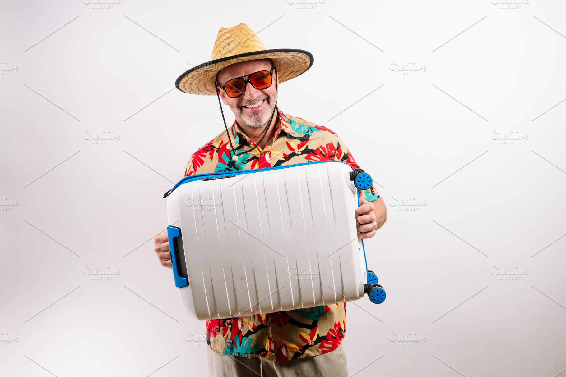 Happy man ready for summer vacation travel., a Holiday Photo by karrastock