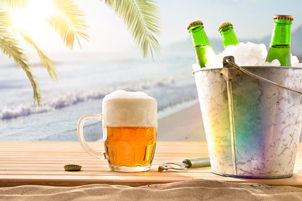 Beer mug and ice bucket filled with beer bottles beach, a Food & Drink Photo by Davizro's Market