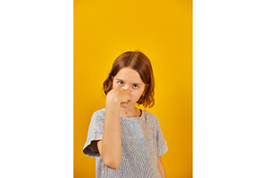 Child making a finger-pointing, a Background Photo by IlliaBondarPhotography