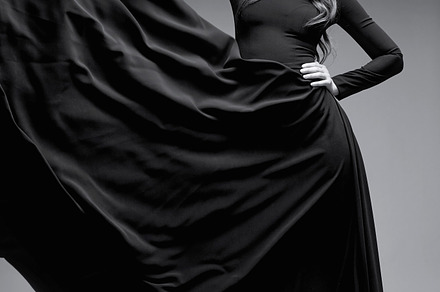 Elegant woman in long black dress stock photo containing black and white, a Beauty & Fashion Photo by MaxFrost