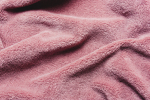 Pink soft teddy fleece texture.