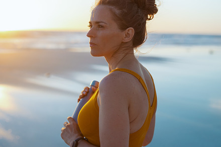healthy sports woman in fitness clothes with bottle of water, a Person Photo by Alliance Images