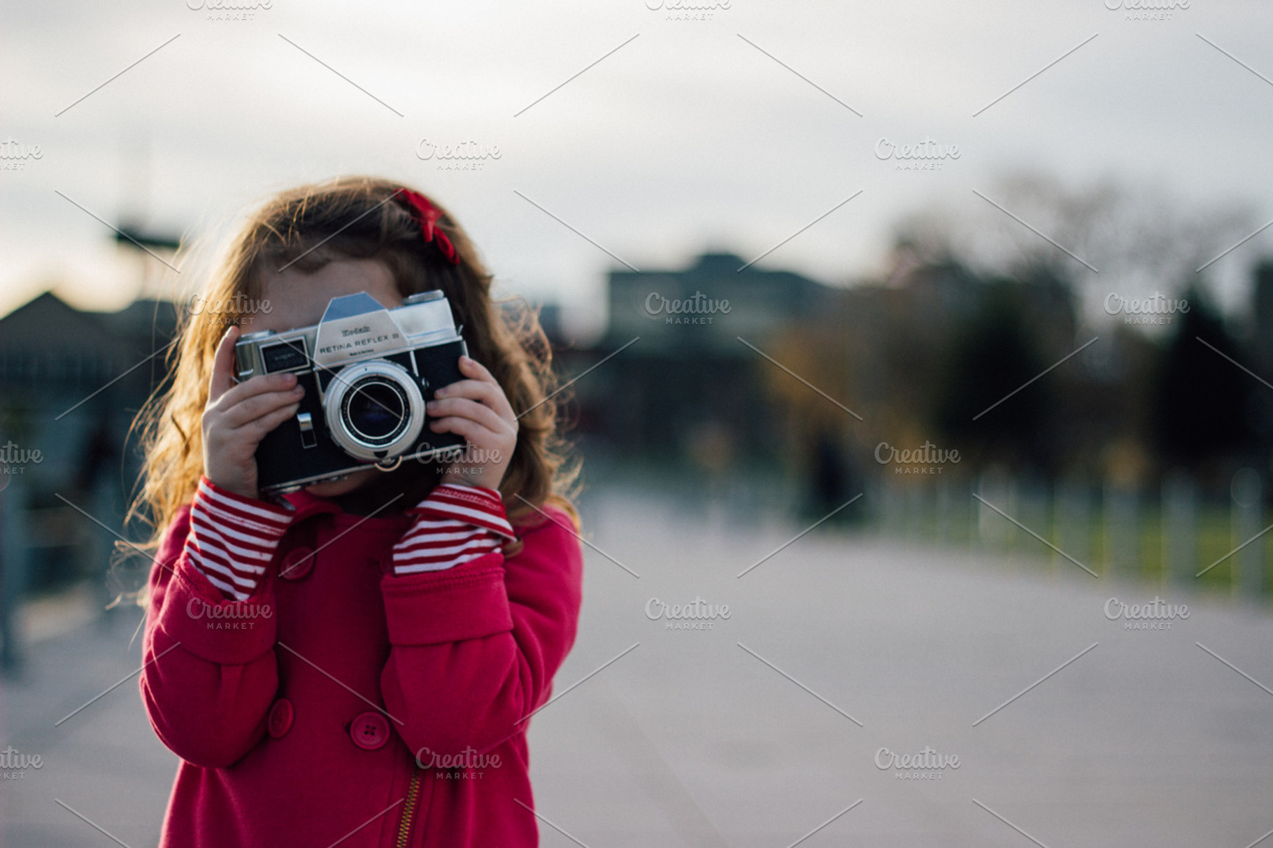Little Girl with a Retro Camera, a Person Photo by Hello Goodbye Studio