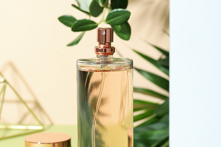 Concept of perfume on multicolor background, blank bottle with s, a Beauty & Fashion Photo by AtlasStudio