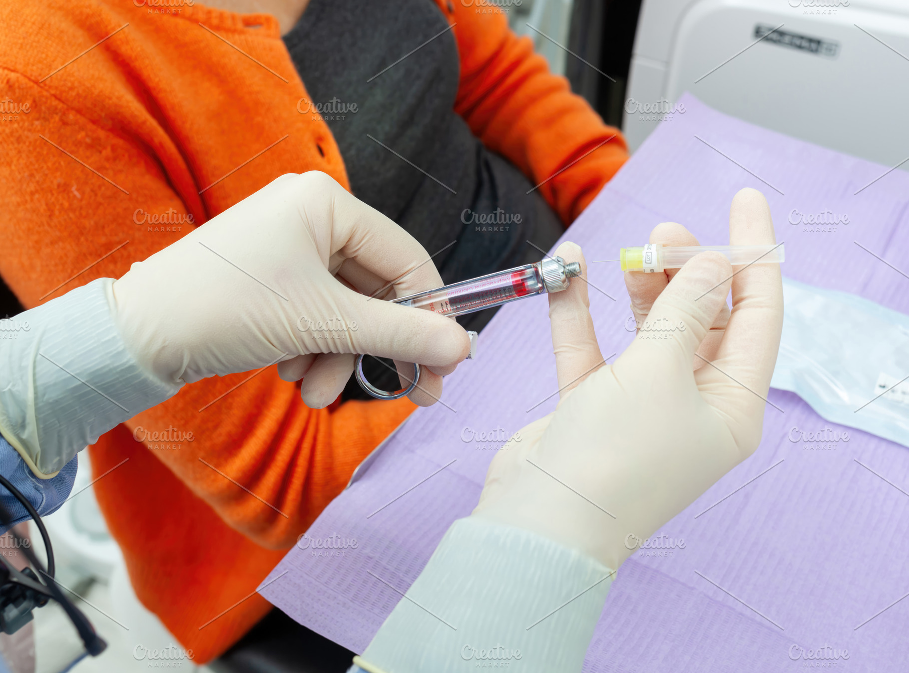 Doctor preparing injection with carpule syringe for local anesthesia, a Health & Medical Photo by Antonio Gravante Market