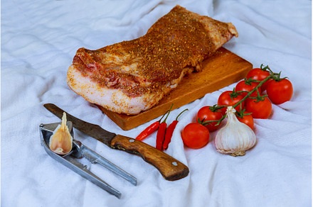 Raw bacon slices with yellow with, a Food & Drink Photo by Ungvar Studio