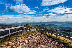 Mountain trail featuring handrails, landscape, and nature